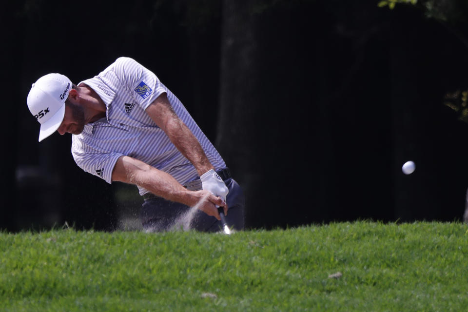 Dustin Johnson hits the ball on the 3rd hole on the third round of competition of the WGC-Mexico Championship at the Chapultepec Golf Club in Mexico City, Saturday, Feb. 23, 2019. (AP Photo/Marco Ugarte)