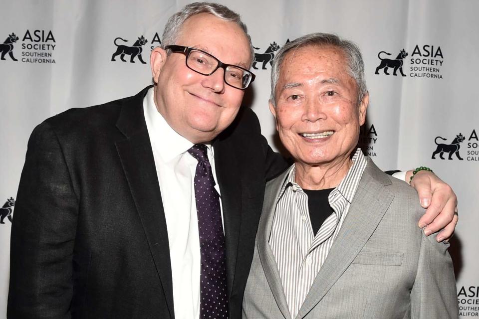 <p>Alberto E. Rodriguez/Getty</p> Brad and George Takei in 2021