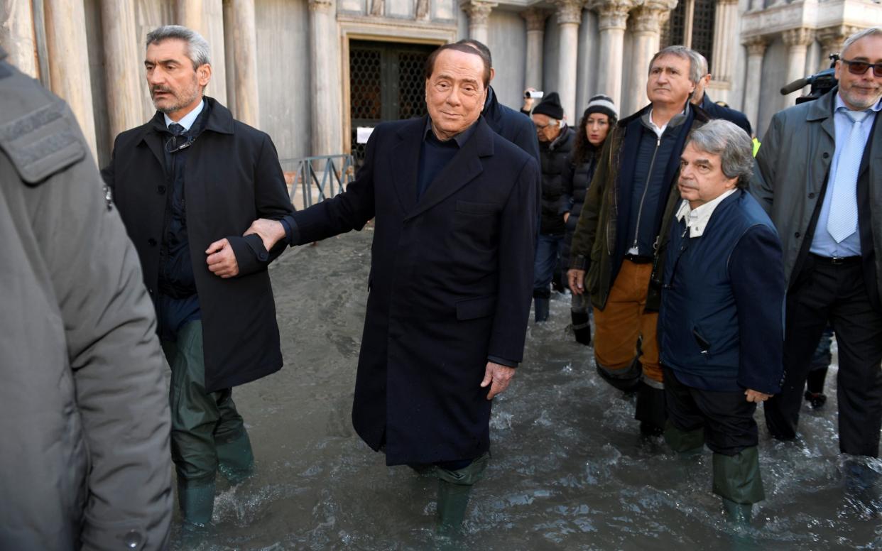 Former Italian Prime Minister Silvio Berlusconi visited the city on Thursday  - REUTERS