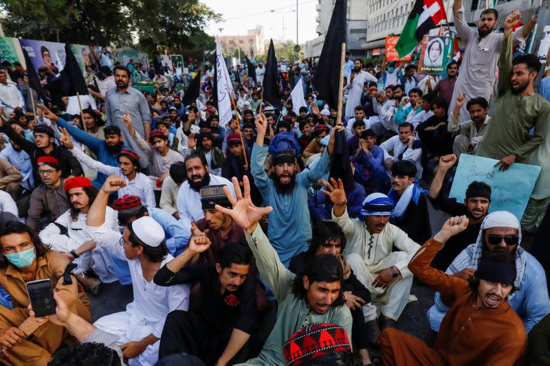 People chant slogans demanding an investigation following the deaths of four teenagers in Jani Khel area in Bannu District of Khyber Pakhtunkhwa (KPK) province, during a protest in Karachi,