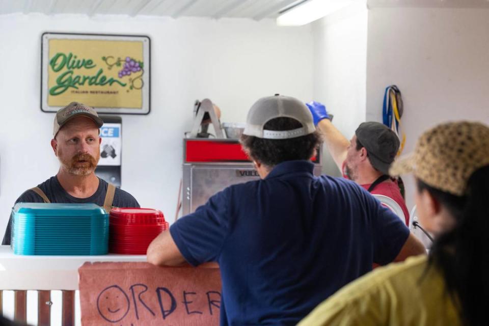 Robbie Robinson, left, serves customers at City Limits Barbeque in West Columbia, South Carolina on Saturday, October 7, 2023. Joshua Boucher/jboucher@thestate.com