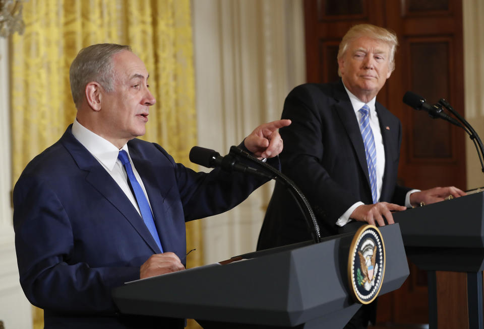 President Trump listens as Israeli Prime Minister Benjamin Netanyahu speaks at their joint news conference on Feb. 15. (Photo: Pablo Martinez Monsivais/AP)