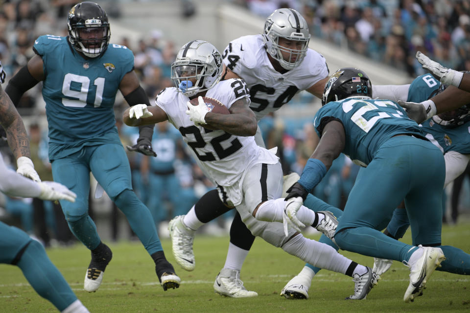 Las Vegas Raiders running back Ameer Abdullah (22) carries the ball against the Jacksonville Jaguars in the first half of an NFL football game Sunday, Nov. 6, 2022, in Jacksonville, Fla. (AP Photo/Phelan M. Ebenhack)