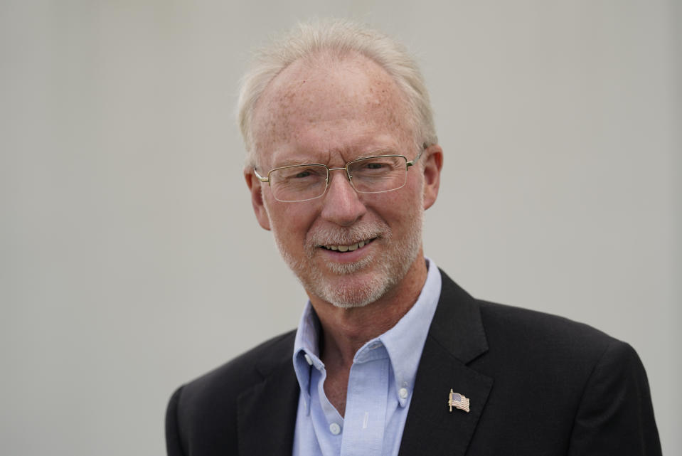 Doug Brown, postal staffer and president of the American Postal Workers Union chapter in Indiana, poses for a picture outside of a post office facility, Monday, Aug. 17, 2020, in Muncie, Ind. The U.S. Postal Service is expected to play a central role in this year's presidential elections with so many states promoting voting by mail amid the coronavirus pandemic. (AP Photo/Darron Cummings)