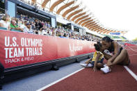 Allyson Felix celebrates after her second place finish in the women's 400-meter run with her daughter Camryn at the U.S. Olympic Track and Field Trials Sunday, June 20, 2021, in Eugene, Ore. (AP Photo/Ashley Landis)