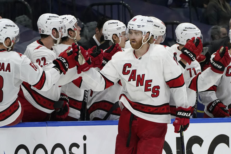 Carolina Hurricanes defenseman Dougie Hamilton (19) celebrates with the bench after his goal against the Tampa Bay Lightning during the second period in Game 4 of an NHL hockey Stanley Cup second-round playoff series Saturday, June 5, 2021, in Tampa, Fla. (AP Photo/Chris O'Meara)