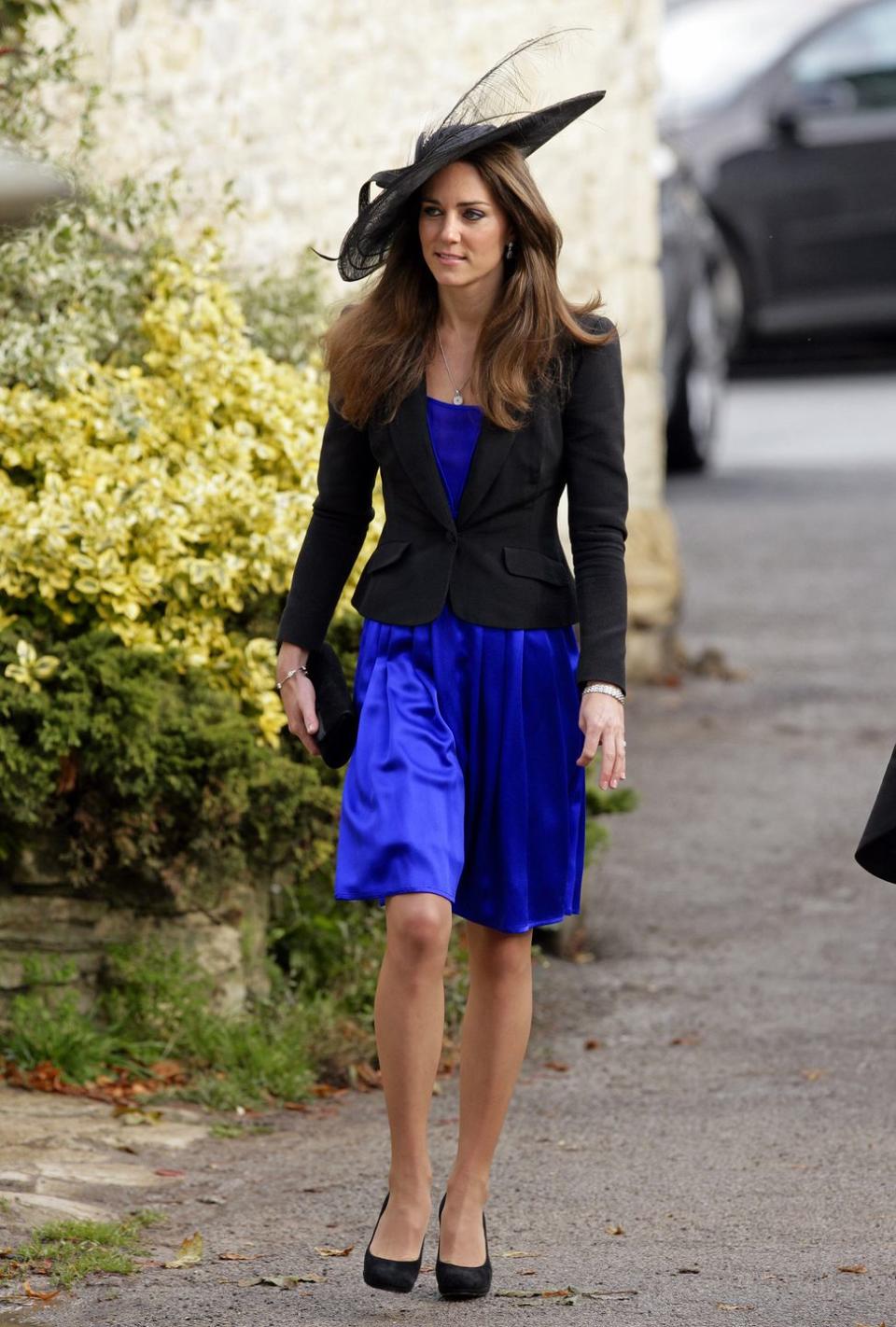 <p>Kate Middleton attending Harry Meade and Rosie Bradford's wedding at the Church of St. Peter and St. Paul on October 23, 2010.</p>