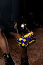 <p>A plaid gold-and-blue chain bag from the Versace FW18 show. (Photo: Getty Images) </p>