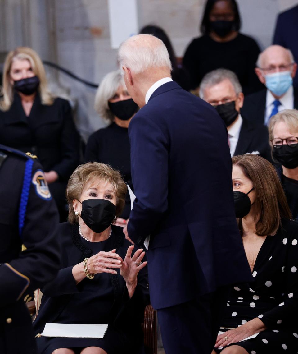 President Joe Biden is greeted by former U.S. Senator Elizabeth Dole (R-NC), the wife of former U.S. Senator Bob Dole, as the casket of former U.S. Senate Majority Leader Bob Dole (R-KS) lies in state in the Rotunda of the U.S. Capitol on Dec. 9, 2021.