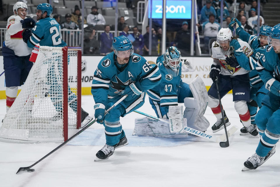 San Jose Sharks defenseman Erik Karlsson (65) looks to pass the puck against the Florida Panthers during the second period of an NHL hockey game in San Jose, Calif., Thursday, Nov. 3, 2022. (AP Photo/Godofredo A. Vásquez)