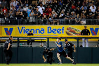 Chicago White Sox security chases one of the three fans that ran onto the field during the ninth inning of the game between the Chicago White Sox and the Seattle Mariners at U.S. Cellular Field on August 25, 2016 in Chicago, Illinois. (Photo by Jon Durr/Getty Images)