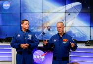 NASA astronauts Doug Hurley (R) and Bob Behnken speak at a news conference