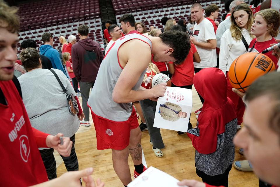 Oct 19, 2023; Columbus, Ohio, USA; Ohio State Buckeyes center Austin Parks (25) signs autographs during an open practice at Value City Arena.