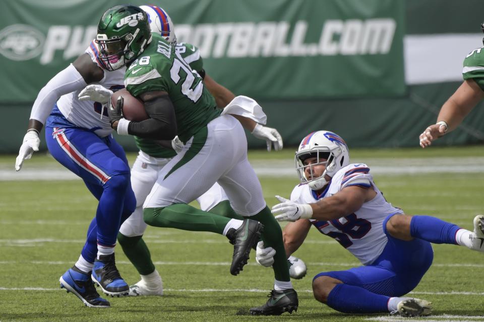 New York Jets' Le'Veon Bell (26) breaks a tackle by Buffalo Bills' Matt Milano (58) during the first half of an NFL football game Sunday, Sept. 8, 2019, in East Rutherford, N.J. (AP Photo/Bill Kostroun)