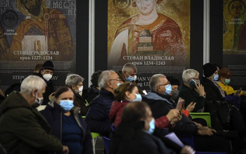 People rest after being given their second dose of the Sinopharm Covid-19 vaccine in Belgrade - Oliver Bunic/Bloomberg