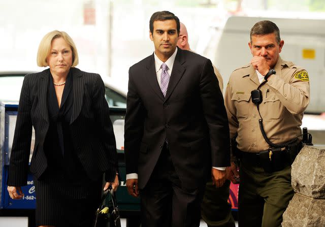 <p>Kevork Djansezian/Getty Images</p> Dr. Sandeep Kapoor (center) arriving for his arraignment at Los Angeles Criminal Courts on May 13, 2009, in Los Angeles, California