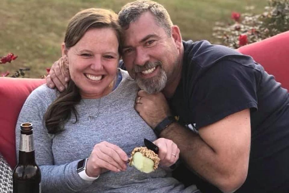 <p>Lindsey Moore</p> Lindsey Moore (L) and her father Ted Lawver. Moore recently gifted her dad a Dan Marino rookie card that he had to sell 30 years ago to help his family financially 