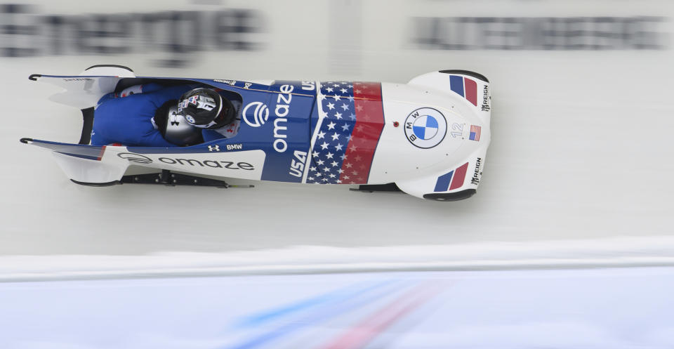 Canada's Kaillie Humphries, who competes for the USA, and Kaysha Love from the USA speed down the track in the two-man-world cup in Altenberg, Germany, Sunday, Dec. 5, 2021. (Robert Michael/dpa via AP)