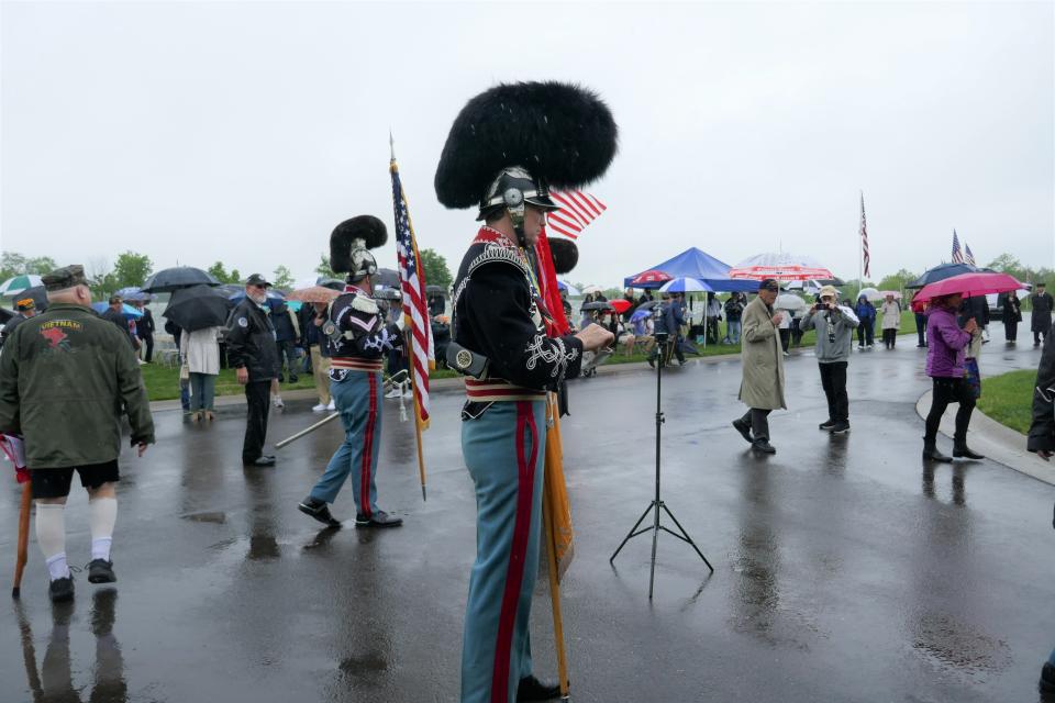 Members of the Pennsylvania National Guard who serve in the First Troop Philadelphia City Calvary prepare for the Presentation of the Colors at the ceremony marking the unveiling of a statue of Gen. George Washington at Washington Crossing National Cemetery in Upper Makefield Saturday.