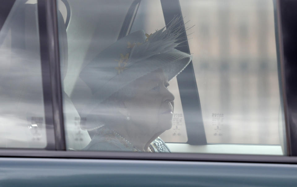 Britain's Queen Elizabeth II leaves Buckingham Palace by car to attend the State Opening of Parliament at the Palace of Westminster in London, Tuesday May 11, 2021. (AP Photo/Alastair Grant)