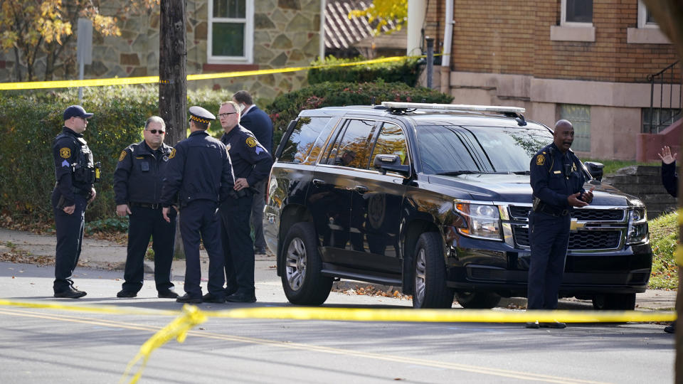 Pittsburgh Police gather outside the Destiny of Faith Church in Pittsburgh, Friday Oct. 28, 2022, where a shooting while a funeral was being held, left several people wounded. (AP Photo/Gene J. Puskar)