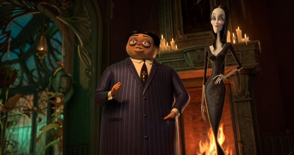 Gomez (voiced by Oscar Isaac, left) and Morticia Addams (Charlize Theron) move their brood to New Jersey in the animated 