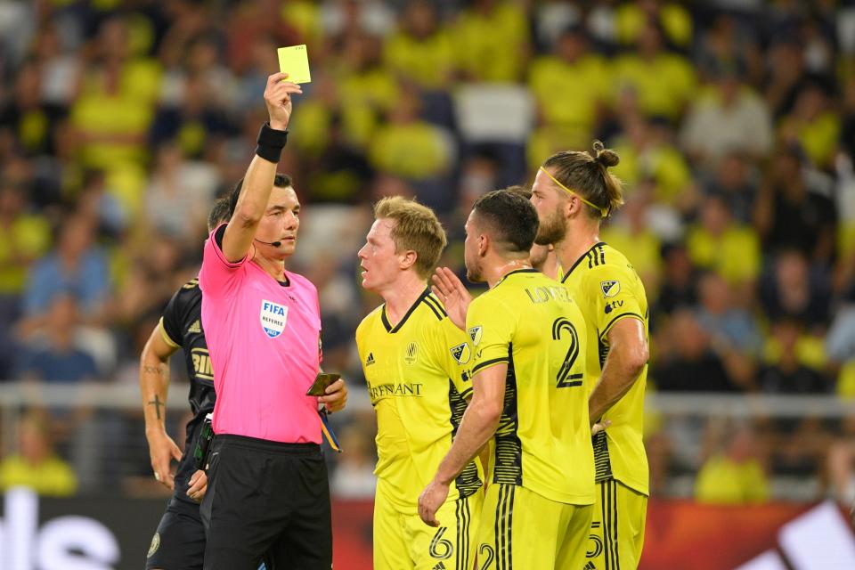 Jul 12, 2023; Nashville, Tennessee, USA; Nashville SC midfielder Dax McCarty (6) receives a yellow card in the first half against the Philadelphia Union at Geodis Park. Mandatory Credit: Steve Roberts-USA TODAY Sports