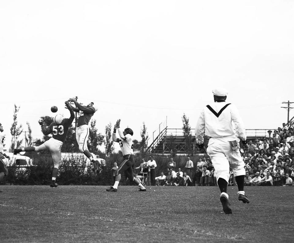 1950: Two University of Texas defenders go in the air to knock down a Texas Tech pass intended for Eural Ramsey in the first quarter of the game at Lubbock. Texas defenders are Don Menasco (53) and Bobby Dillon (42). Texas won, 28-14.