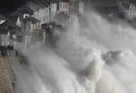 <p>Large waves crash along sea defenses and the harbor as storm Ophelia approaches Porthleven in Cornwall, south west Britain, Oct. 16, 2017. (Photo: Toby Melville/Reuters) </p>