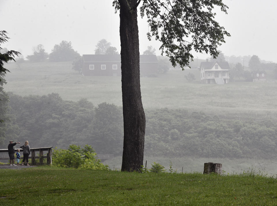 Visitors at the Johnstown National Flood Memorial in St. Michael, Pa. spend time checking out the park as the air quality is poor due to the Canadian wild fires on Wednesday, June 28, 2023. (Todd Berkey/The Tribune-Democrat via AP)