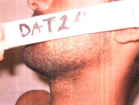 An identifying marker is held against the face of a detainee in an undated photo from Iraq's Abu Ghraib prison, among 198 images released in a Freedom of Information Act (FOIA) lawsuit against the U.S. Department of Defense in Washington, DC February 5, 2016. REUTERS/DoD/Handout via Reuters