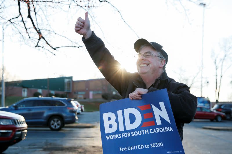 Volunteer Jim Gillespie of Philadelphia holds a campaign sign supporting Democratic U.S. presidential candidate and former U.S. Vice President Joe Biden outside a polling site in Greenville