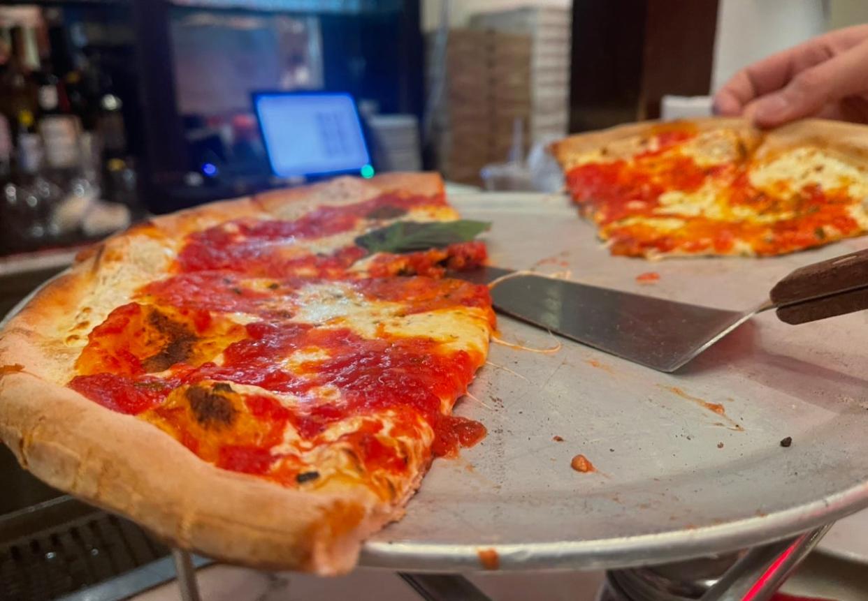 Coal-oven, plain pizza from Angelo's Pizza in New York City.