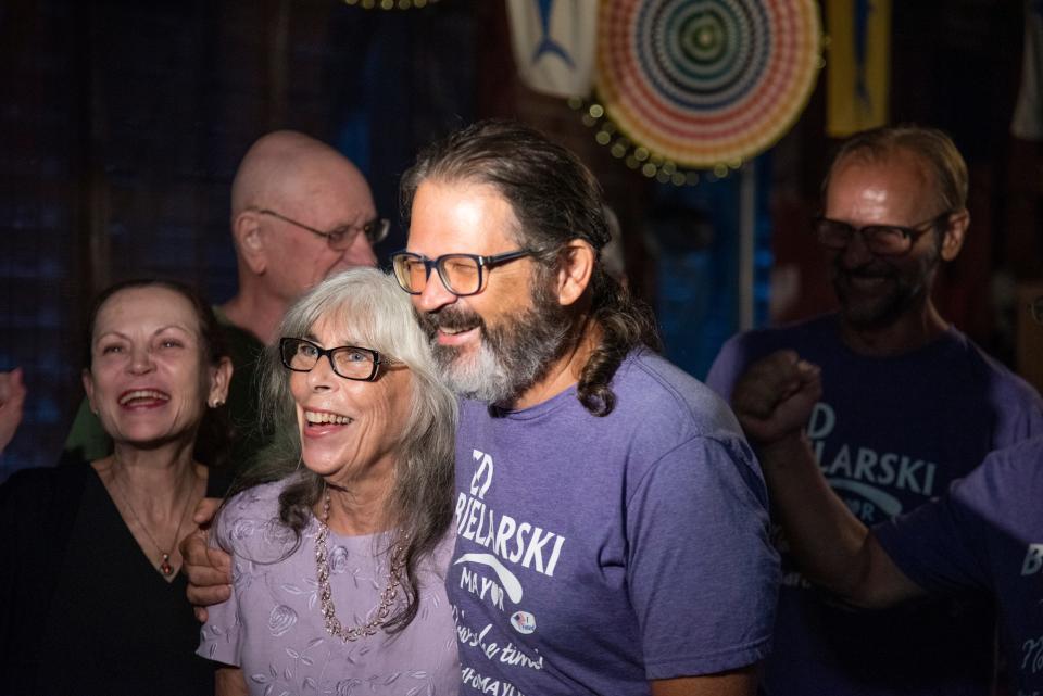 Gainesville mayoral candidate Ed Bielarski embraces wife Melinda during a election night party at Ballyhoo Grill in Gainesville on Aug. 23.