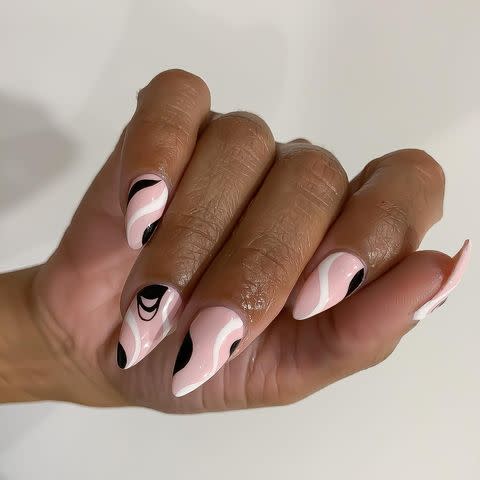 <p>What <strong>pairs perfectly with a sharp, pointy <a href="https://www.cosmopolitan.com/style-beauty/beauty/g10223890/stiletto-nails-art-design/" rel="nofollow noopener" target="_blank" data-ylk="slk:stiletto nail shape;elm:context_link;itc:0;sec:content-canvas" class="link ">stiletto nail shape</a></strong>? A soft, curvy design over the top of subtle <a href="https://www.cosmopolitan.com/style-beauty/beauty/g28495772/pink-nail-polish-colors/" rel="nofollow noopener" target="_blank" data-ylk="slk:pink polish;elm:context_link;itc:0;sec:content-canvas" class="link ">pink polish</a>. Remember, it's all about ~balance~.</p><p><a href="https://www.instagram.com/p/CHqRX7yDXWK/?utm_source=ig_embed&utm_campaign=loading" rel="nofollow noopener" target="_blank" data-ylk="slk:See the original post on Instagram;elm:context_link;itc:0;sec:content-canvas" class="link ">See the original post on Instagram</a></p>