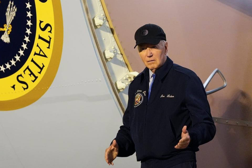 President Joe Biden walks down the steps of Air Force One at Dover Air Force Base in Delaware after abandoning his campaign trail in Las Vegas after contracting Covid (AP)