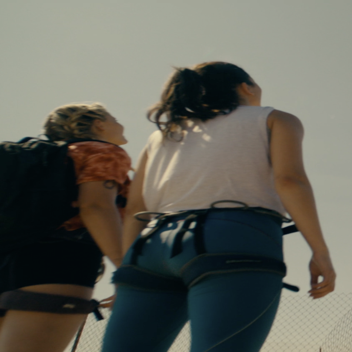 Two girls gaze up at a 2000 ft tower.