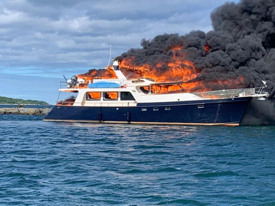 A 70-foot Marlow yacht is on fire off the coast of New Castle Saturday, June 18, 2022.