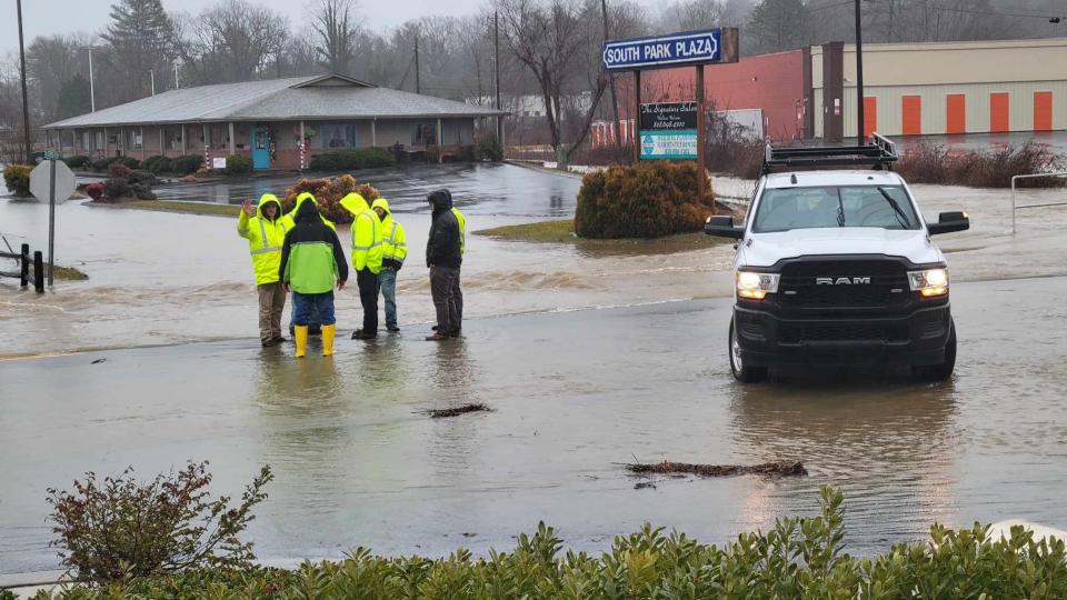 Hendersonville Public Works employees monitor the flooding around Publix on Greenville Highway on Jan. 9 in Hendersonville.