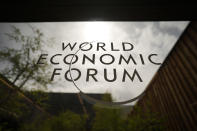 The logo of the World Economy Forum is displayed at a window of the venue prior to the opening of the event in Davos, Switzerland, Sunday, May 22, 2022. The annual meeting of the World Economy Forum is taking place in Davos from May. 22 until May. 26, 2020. (AP Photo/Markus Schreiber)