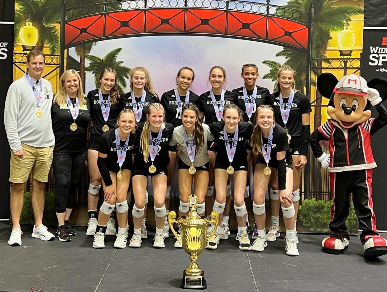 The Boiler Juniors volleyball club poses with their AAU 14 Open national championship trophy on Saturday, June 18, 2022 at Disney's Wide World of Sports in Florida.