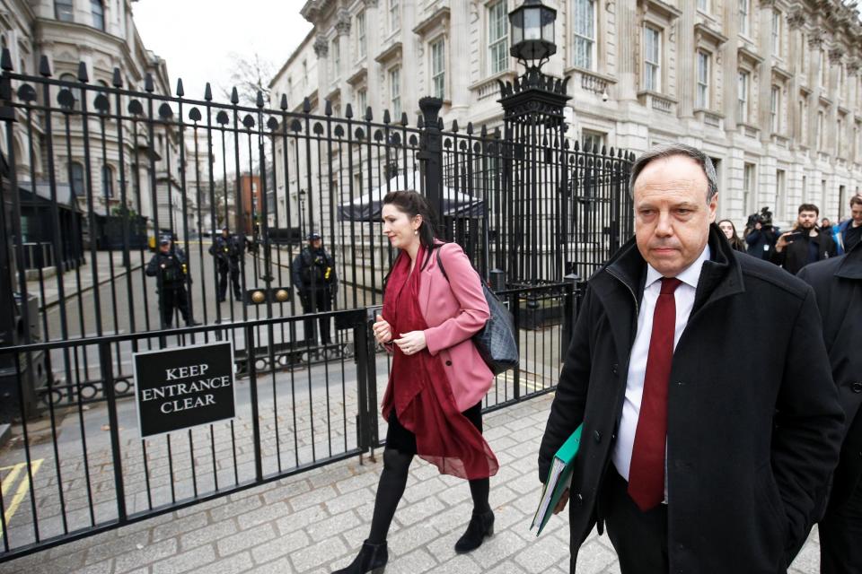 Mr Dodds, walks across Downing Street in central London on Friday (REUTERS)