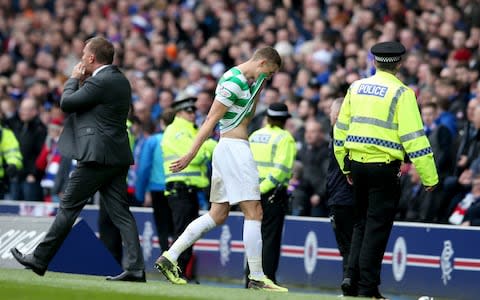 Celtic's Jozo Simunovic leaves the pitch - Credit: PA