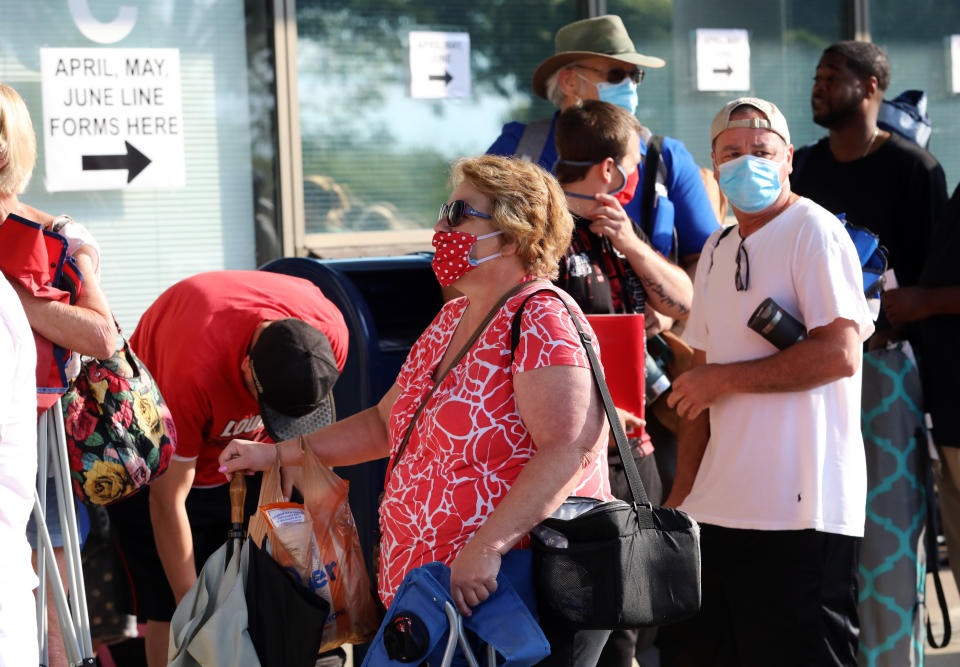 FRANKFORT, KY - JUNE 19: Hundreds of unemployed Kentucky residents wait in long lines outside the Kentucky Career Center for help with their unemployment claims on June 19, 2020 in Frankfort, Kentucky. (Photo by John Sommers II/Getty Images)