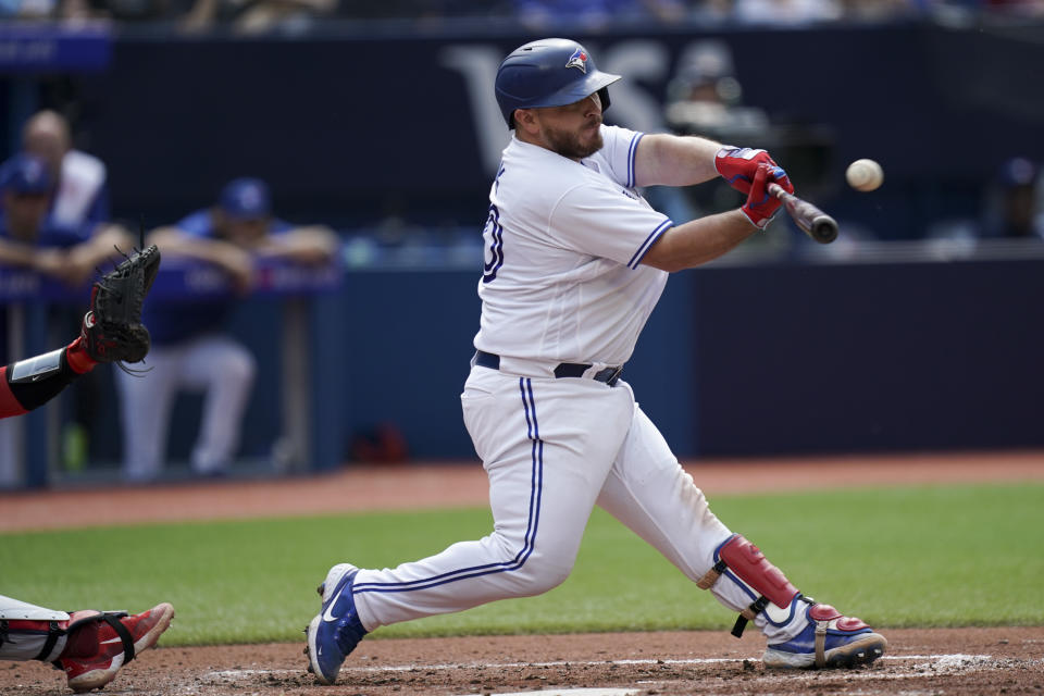 Toronto Blue Jays Alejandro Kirk (30) hits a pitch during the third inning of a baseball game against the Minnesota Twins in Toronto, Saturday, June 10, 2023. (Arlyn McAdorey/The Canadian Press via AP)