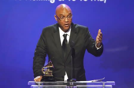 Billy Childs accepts the award for best arrangmeent, instrument and vocals, for "New York Tendaberry" at the 57th annual Grammy Awards in Los Angeles, California, February 8, 2015. REUTERS/Lucy Nicholson