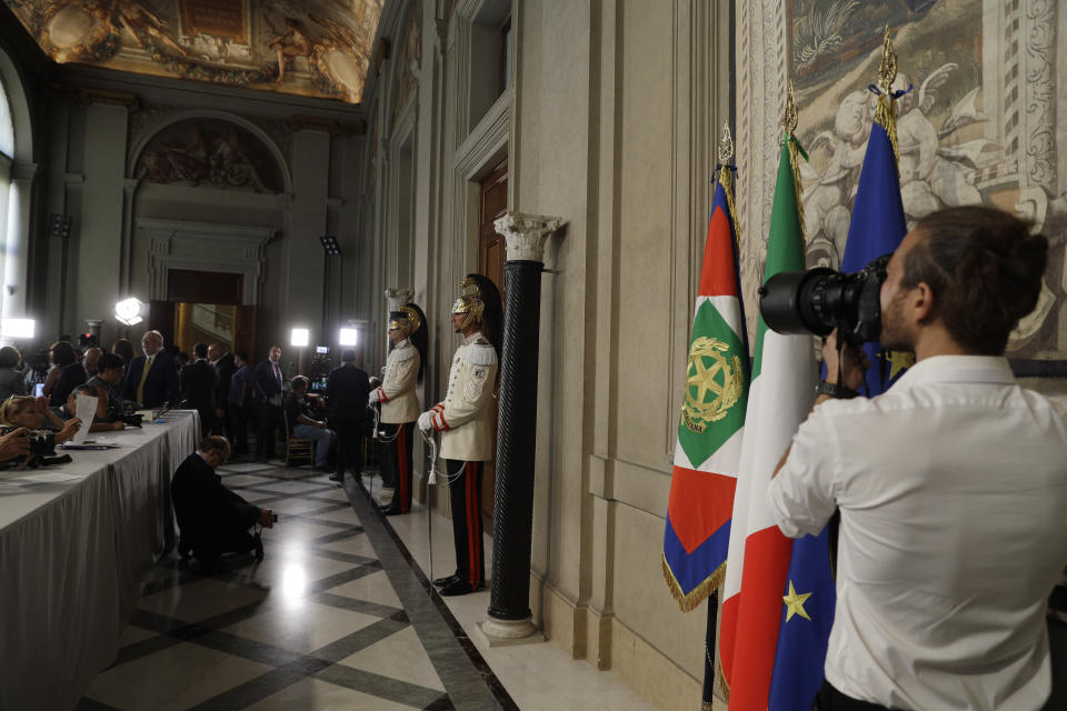 Me did representatives wait outside the office door of President Sergio Mattarella, in Rome, Wednesday, Aug. 21, 2019. One day after Giuseppe Conte resigned as premier, President Sergio Mattarella started receiving political leaders to explore options for the way forward. (AP Photo/Gregorio Borgia)