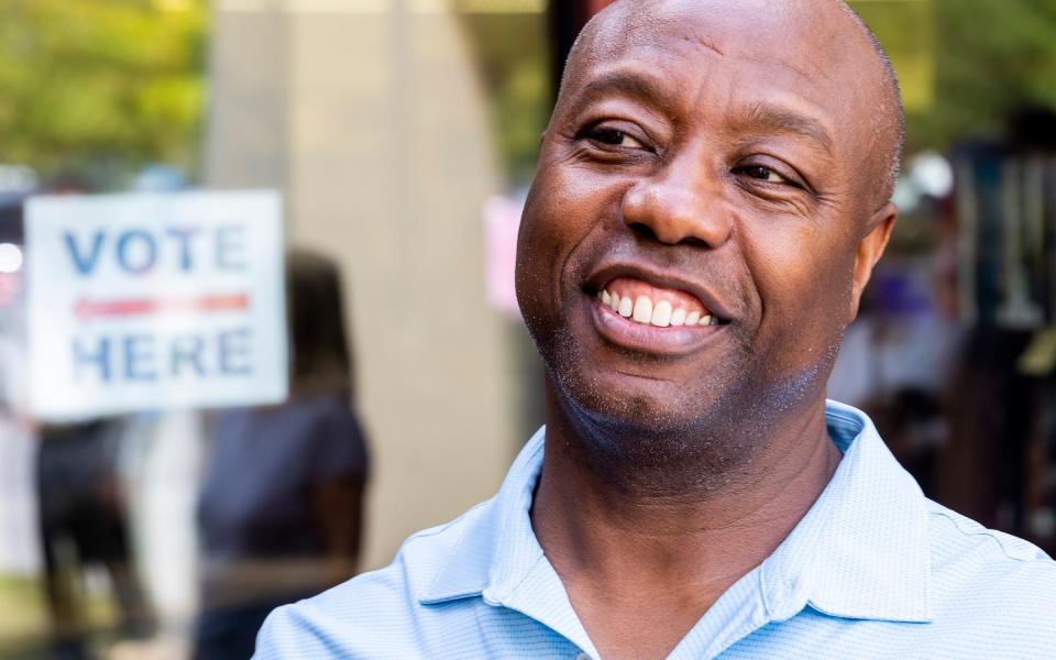 Tim Scott is cheery this evening in South Carolina - AP Photo/Mic Smith