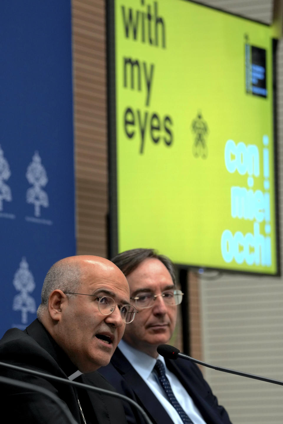 From left, Vatican Prefect of the Dicastery for Culture and Education, Card. José Tolentino de Mendonça and Giovanni Russo, head of the Italian Prison Administration attend a press conference at The Vatican, Monday, March 11, 2024, to present "With my Eyes", the Holy See pavillion for the 60th edition of the Venice Biennale of Arts opening on April 20th, 2024. (AP Photo/Domenico Stinellis)