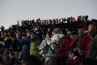 Hundreds of climbers watch the sunrise from the summit of Mount Fuji in Japan, Saturday, Aug. 3, 2019. (AP Photo/Jae C. Hong)